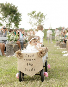 Baby Flower Girl Being Pulled In Wagon