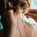 bride-getting-hair-ribbon-tied