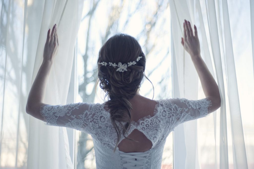 Morning Wedding - Bride Looking Out Window