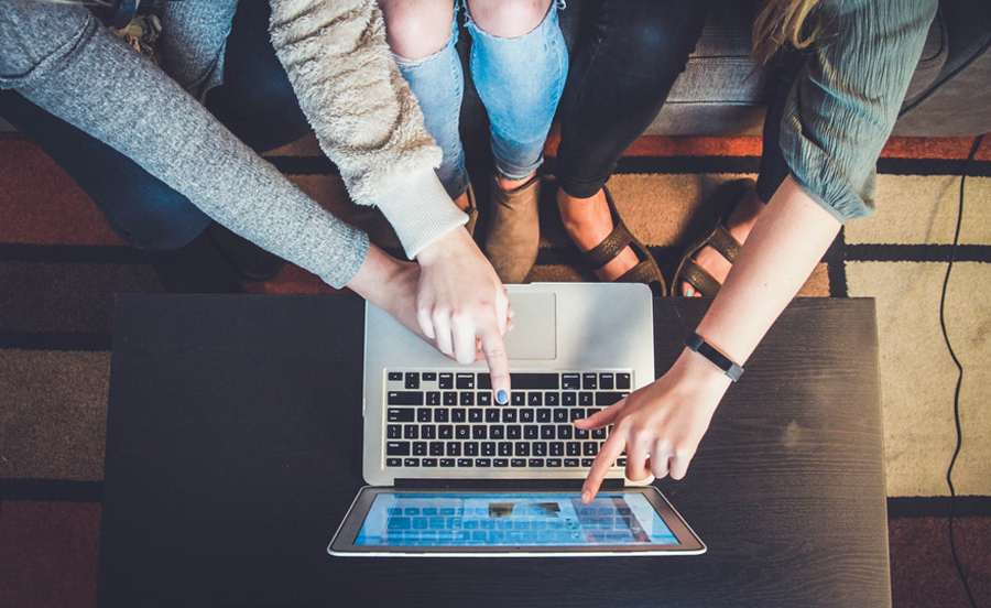 Overhead View Three Women On A Laptop