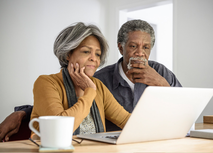 Embarrassing Bridal Questions - Older Couple looking At Laptop