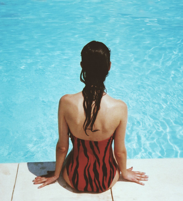 Wedding Planning - Woman Sitting On The Edge Of Pool