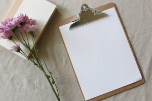 Clipboard with blank paper.
